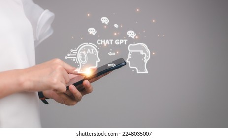 ChatGPT Chat with AI or Artificial Intelligence. woman chatting with a smart AI or artificial intelligence using an artificial intelligence chatbot developed by OpenAI.