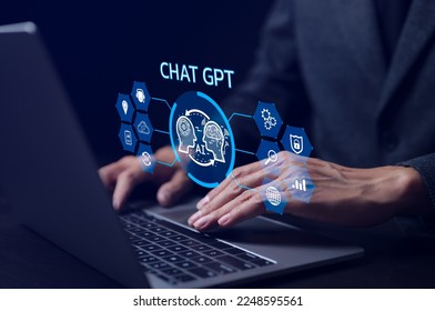 ChatGPT Chat with AI or Artificial Intelligence technology. businessman using a laptop computer chatting with an intelligent artificial intelligence. Developed by OpenAI. Futuristic technology.