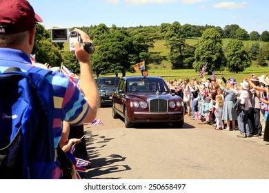 CHATSWORTH, DERBYSHIRE, UK.  CIRCA- JULY 10, 2014. The Royal Car Carrying Queen Elizabeth And Prince Philip On A Visit To Chatsworth House In Derbyshire.