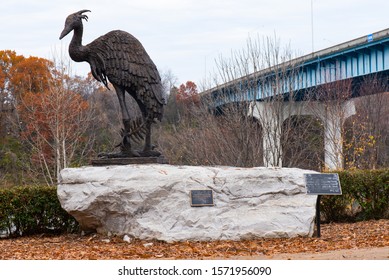 Chattanooga, Tennessee, USA // 11-27-19 : Blue Heron Statue Located Along The Sidewalk In Riverpark During The Fall Leaf Color Change. 