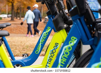 Chattanooga, Tennessee, USA // 11-27-19 : A Couple Enjoy A Fall Walk At Riverpark In Chattanooga, Tn With Bike Rental Rack In The Foreground. 