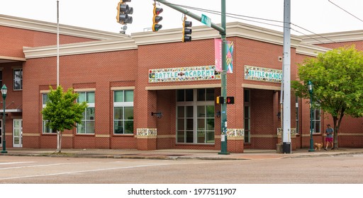 CHATTANOOGA, TN, USA-9 MAY 2021: Corner View Of The  Battle Academy, A K-5 Magnet School In Southside Of Downtown.  Emphasis On Diversity In Race, Socioeconomics And Geography. One Man Walking Dog.