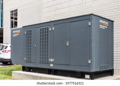 CHATTANOOGA, TN, USA-9 MAY 2021: Industrial Generac generator, on concrete pad.