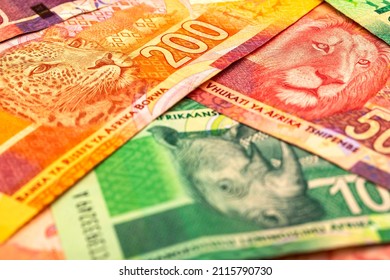 CHATTERIS, CAMBRIDGESHIRE, UK - JANUARY 30, 2022: A Macro Image Of A Colourful Array Of South African Rand Bank Notes, In Various Denominations, Images Of Wildlife Such As Leopard, Elephant And Rhino.