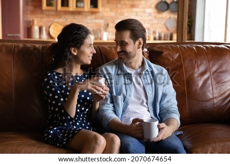 Similar – Image, Stock Photo Side view of loving couple looking at each other