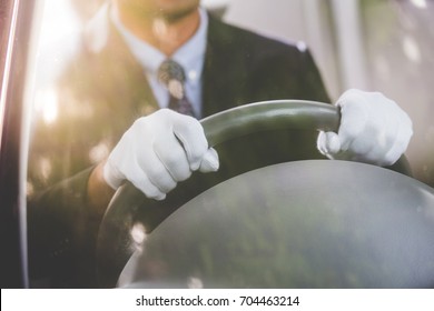 Chauffeur Driving A Car ,hands Close Up