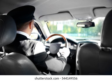 Chauffeur driving a car, view from inside