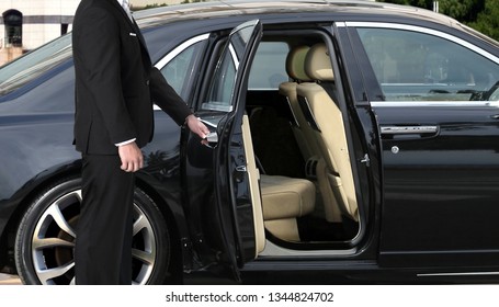Chauffeur opening car door 