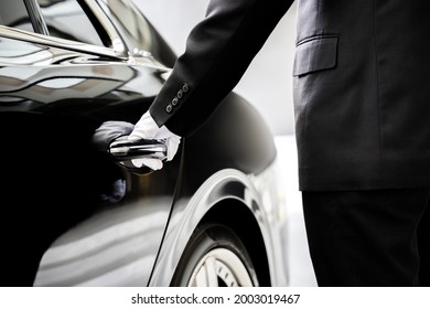 A Chauffeur Opening Car Door 