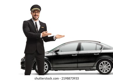 Chauffeur Pointing At A Black Car Isolated On White Background