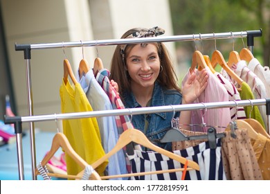 Cheap Clothes. Pleasant Nice Woman Coming To The Second Hand Sale While Wanting To Buy Cheap Clothes