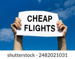 cheap flights, special offer promotion for flight tickets, hands holding paper announcement, low cost airline