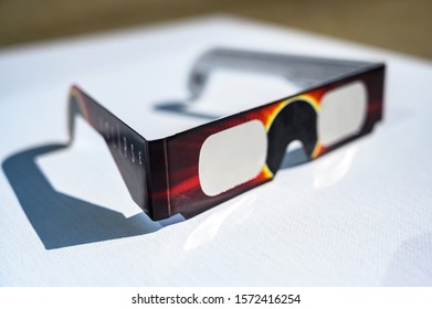 Cheap Solar eclipse shade glasses on white board