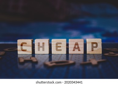 CHEAP Text Sign On Wooden Blocks. Concept Of Pros And Cons Of Investing In Penny Stock. Selective Focus On The Blocks. 