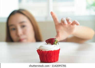 Cheated During Dieting. Young Girl Sneaking To Eat Bakery On Loss Weight Program.