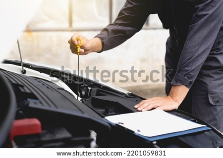 Check the availability of engine oil, car service and maintenance, service, engine concept, car mechanic. car engine check Ready to check and write to clipboard Repair Checklist