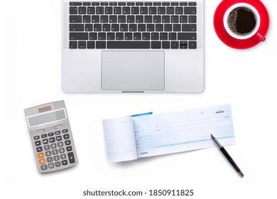 Check Book, Pen, Laptop Computer Keyboard With Blank Screen And Red Cup Of Coffee Isolated On White Office Desk Background. Top View. Flat Lay