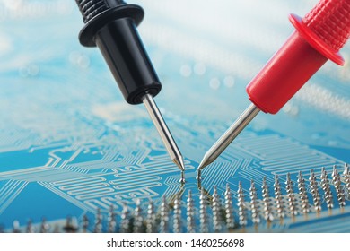 Check by multimeter, electronic circuit board of digital device with components. Troubleshooting in the electronic device. - Powered by Shutterstock