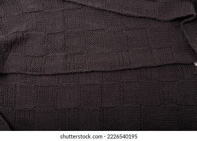 Check or checkerboard knitted grey fabric texture. Textile, scarf or sweater textured background. Warm accessories, clothing, fashion concept - Shutterstock ID 2226540195