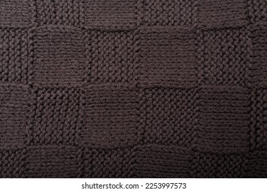 Check or checkerboard knitted grey fabric texture. Textile, scarf or sweater textured background. Warm accessories, clothing, fashion concept - Shutterstock ID 2253997573