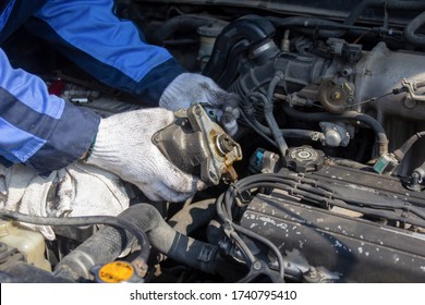 Check engine ignition system and change ignition coil. Car care service.
Replacing ignition coil and spark plugs.
Car mechanic fixing ignition coil on gasoline engine.