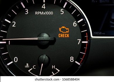 Check engine light illuminated on dashboard.  - Shutterstock ID 1068588404