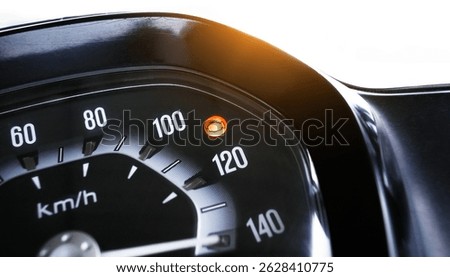 Check Engine Light On, Closeup of a motorcycle speedometer showing an illuminated orange check engine warning light. The speedometer displays kilometers per hour.
