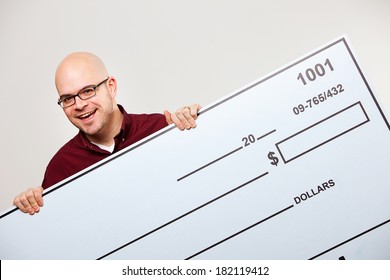 Check: Excited Man Holding Up Oversized Blank Check