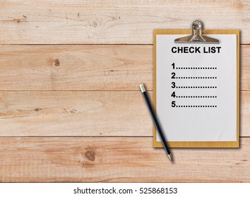 Check List On Paper Clipboard And Pencil On Wood Background