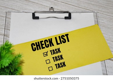 Check list with task boxes on yellow paper.Task list and organization concept.