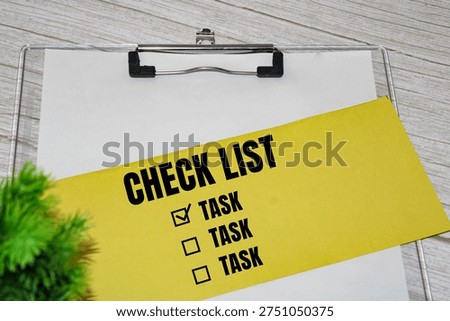 Check list with task boxes on yellow paper.Task list and organization concept.