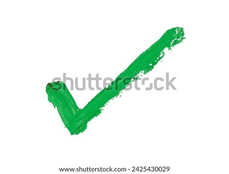 Check mark painted with thick green oil paint on white background with clipping path