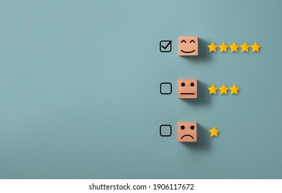 Check mark to select smile face with five stars on blue background , Customer evaluation concept.