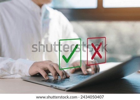 check right and wrong marks on a laptop. concept decide to choose vote. yes or no decisions, and business options for difficult situations in dilemma. true and false symbols agreeing