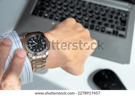 check the time while working on a computer