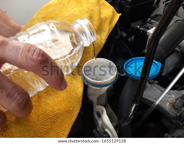 Check water in Car radiator , Add\
water to car radiator ,Car car maintenance\
service.