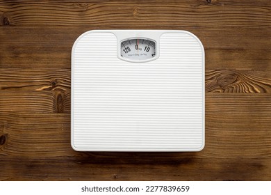 Check your body shape with white weight scales, top view. - Powered by Shutterstock