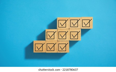 Checkbox on wooden cubes. Business concept - Shutterstock ID 2218780637