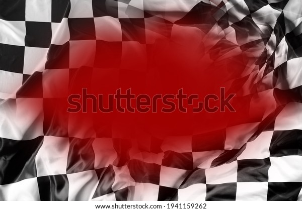 Checkered black and white flag on red background.\
Copy space\
