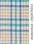 Checkered fabric in blue, white and yellow as a background. Towel or scuttle as a background.