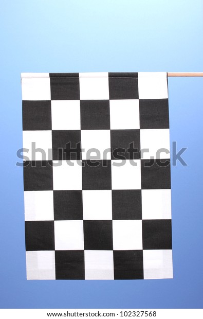 Checkered finish flag on\
blue background