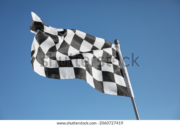 Checkered finish\
flag on light blue\
background