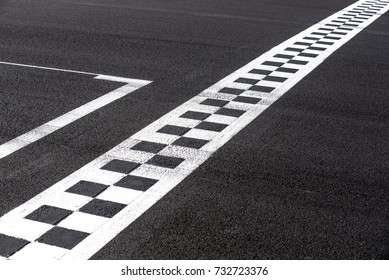 Checkered Finish Line On Asphalt Motorsport Racing Track Concept Of Goal, Achievement, Success