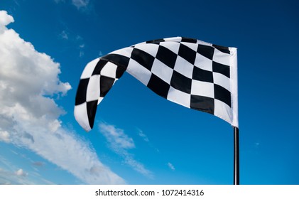 Checkered Flag On Blue Sky