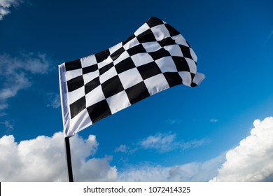 Checkered Flag On Blue Sky