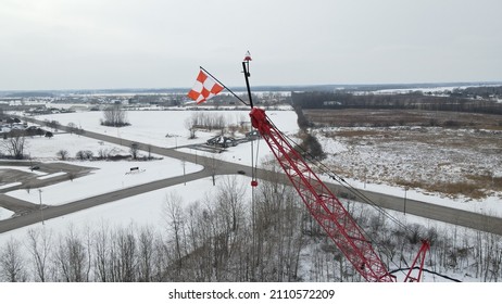 checkered flag on crane at elevated angle
