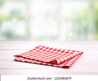 Checkered Folded Gingham Red Picnic Cloth On Wooden Table Empty Space Backdrop.Kitchen Napkin.