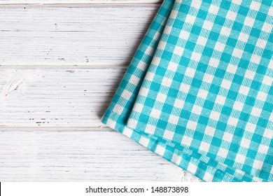 Checkered Napkin On Wooden Table