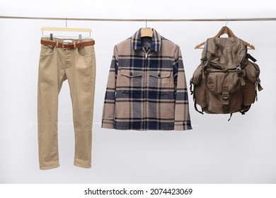 Checkered Paid Shirt ,jacket With Khaki Pants, Backpack Closeup Isolated On Hanger