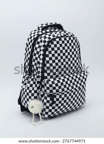 Checkered Pattern School Backpack on a gray background